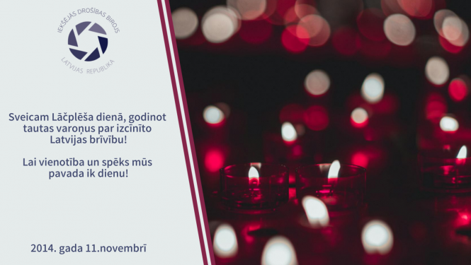 Apsveikums Lāčplēša dienā ar tekstu: Sveicam Lāčplēša dienā, godinot tautas varoņus par izcīnīto Latvijas brīvību! Lai vienotība un spēks mūs pavada ik dienu! Uz attēla iedegtas tumši sarkanas svecītes, Latvijas karoga motīvs, Iekšējās drošības biroja logo, 