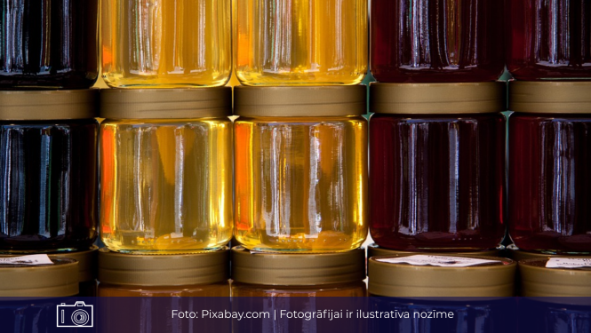 Attēls ar medus burciņām